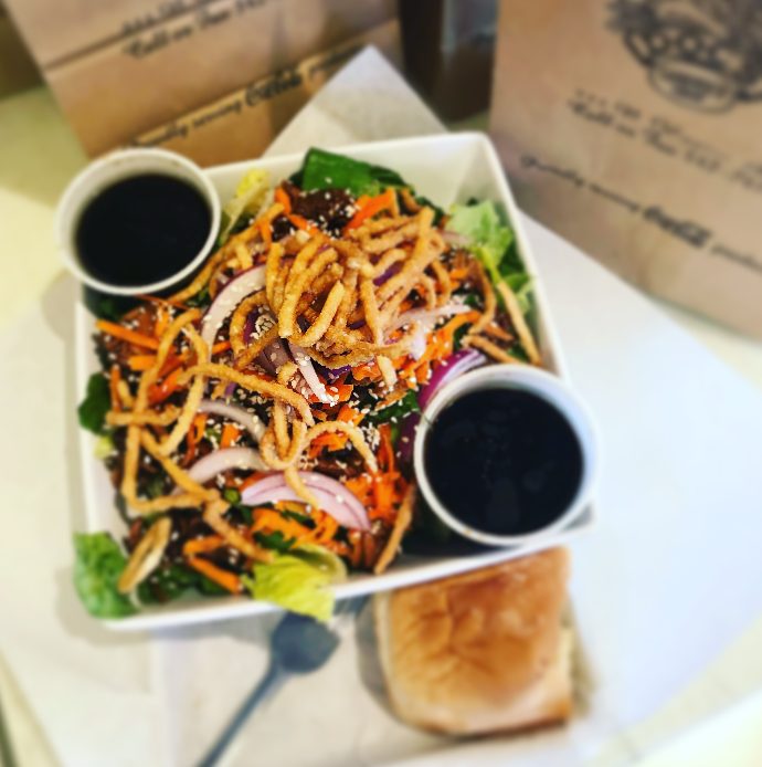 Teriyaki sesame chicken — dressing on the side, always.